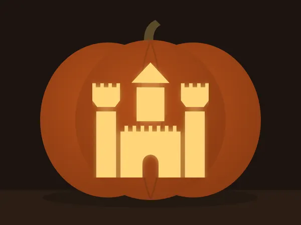 Geschnitzter Kürbis mit dem Motiv „Schloss“, von einer Kerze beleuchtet