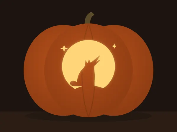 Carved pumpkin with the howling wolf pattern, lit by a candle