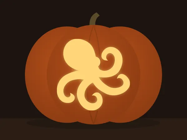 Geschnitzter Kürbis mit dem Motiv „Oktopus“, von einer Kerze beleuchtet