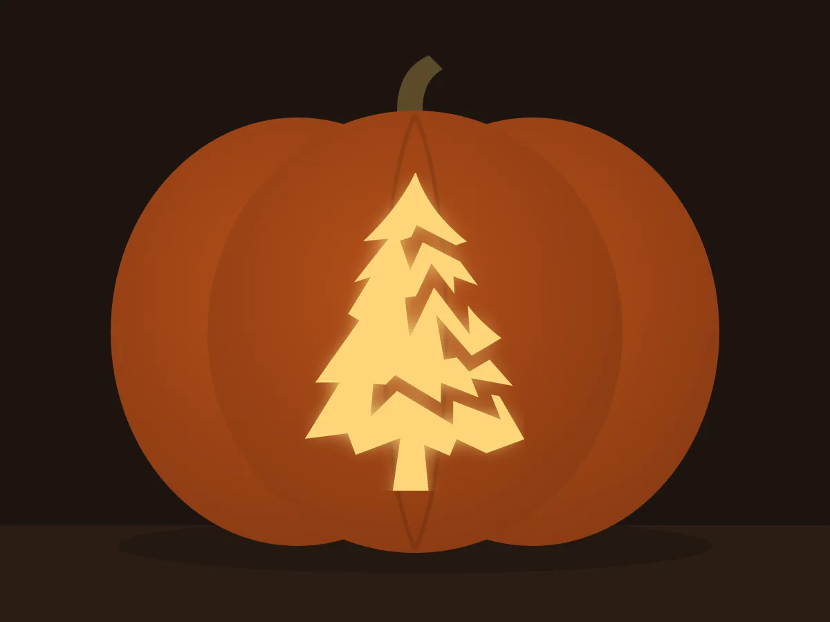 Carved pumpkin with the pine tree pattern, lit by a candle