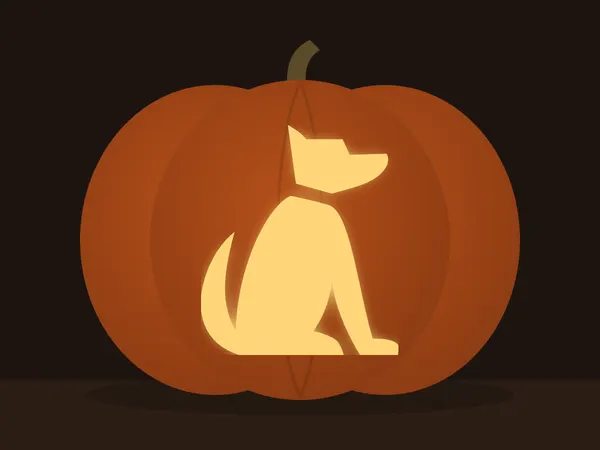 Geschnitzter Kürbis mit dem Motiv „Sitzender Hund“, von einer Kerze beleuchtet