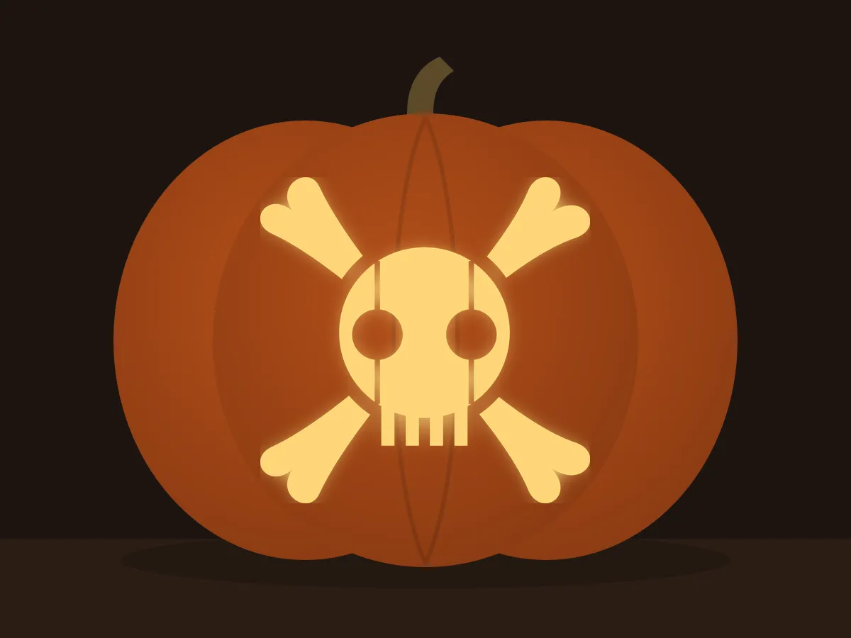 Carved pumpkin with the skull and crossbones pattern, lit by a candle