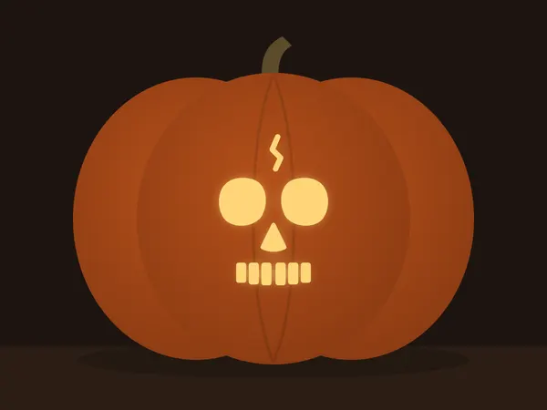 Carved pumpkin with the skull face pattern, lit by a candle