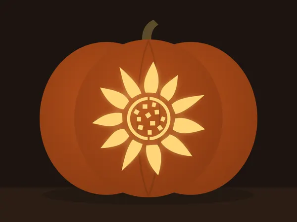 Geschnitzter Kürbis mit dem Motiv „Sonnenblume“, von einer Kerze beleuchtet