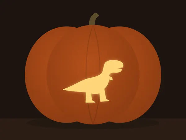 Carved pumpkin with the t-rex pattern, lit by a candle