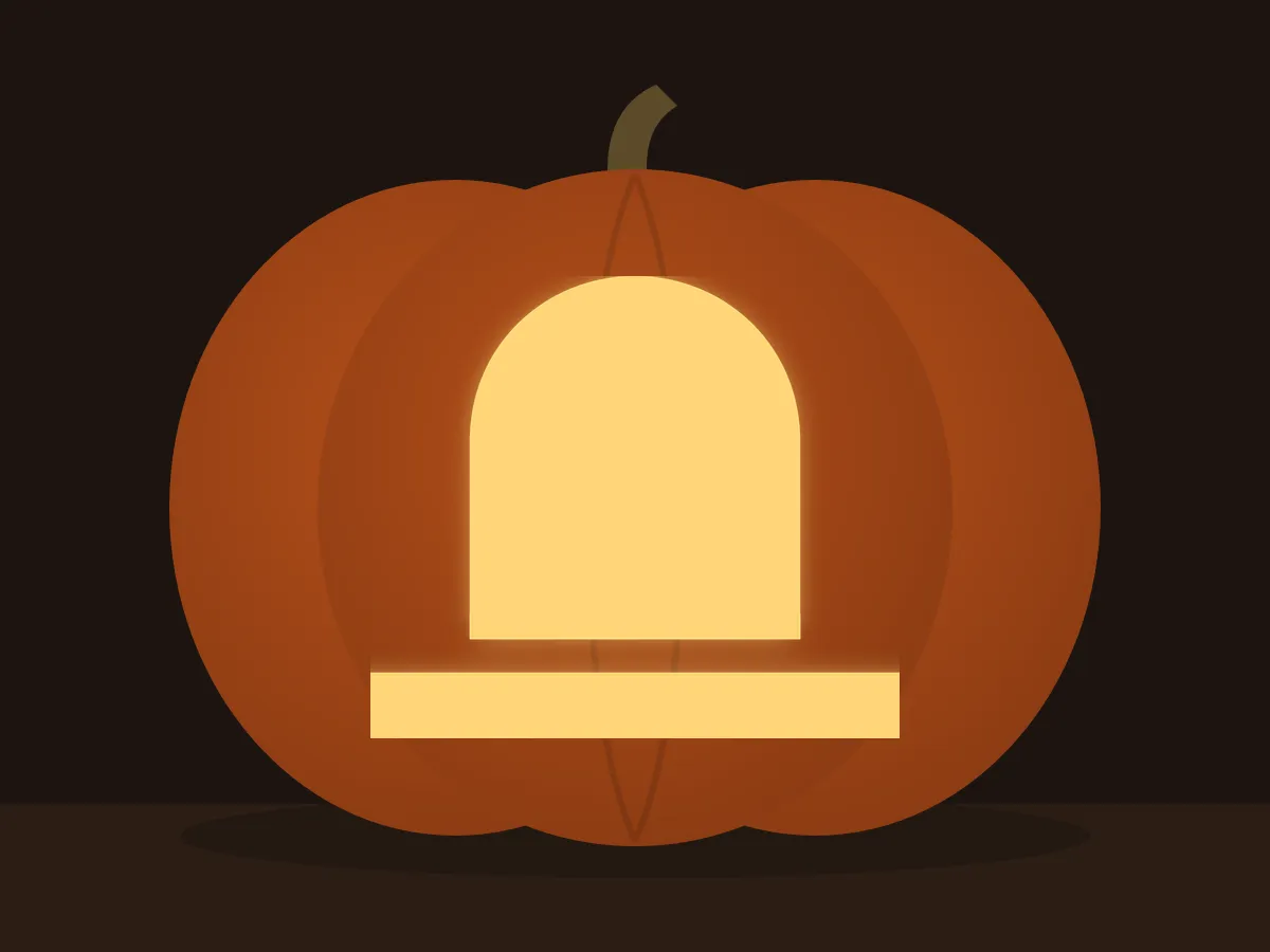 Carved pumpkin with the tombstone pattern, lit by a candle