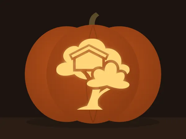 Carved pumpkin with the treehouse pattern, lit by a candle