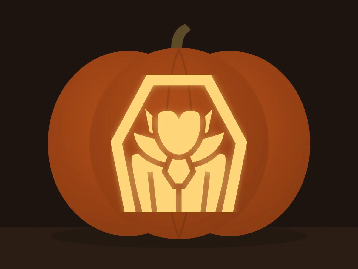 Carved pumpkin with the vampire in a coffin pattern, lit by a candle