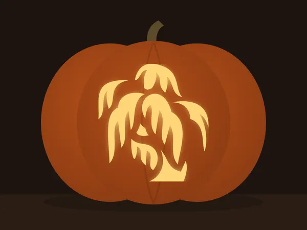 Carved pumpkin with the willow tree pattern, lit by a candle
